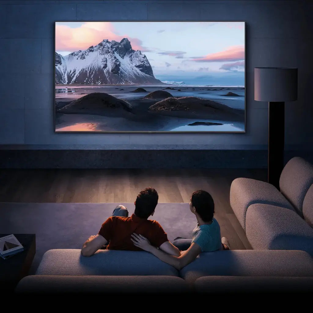 Couple watching oversized wall-mounted TV