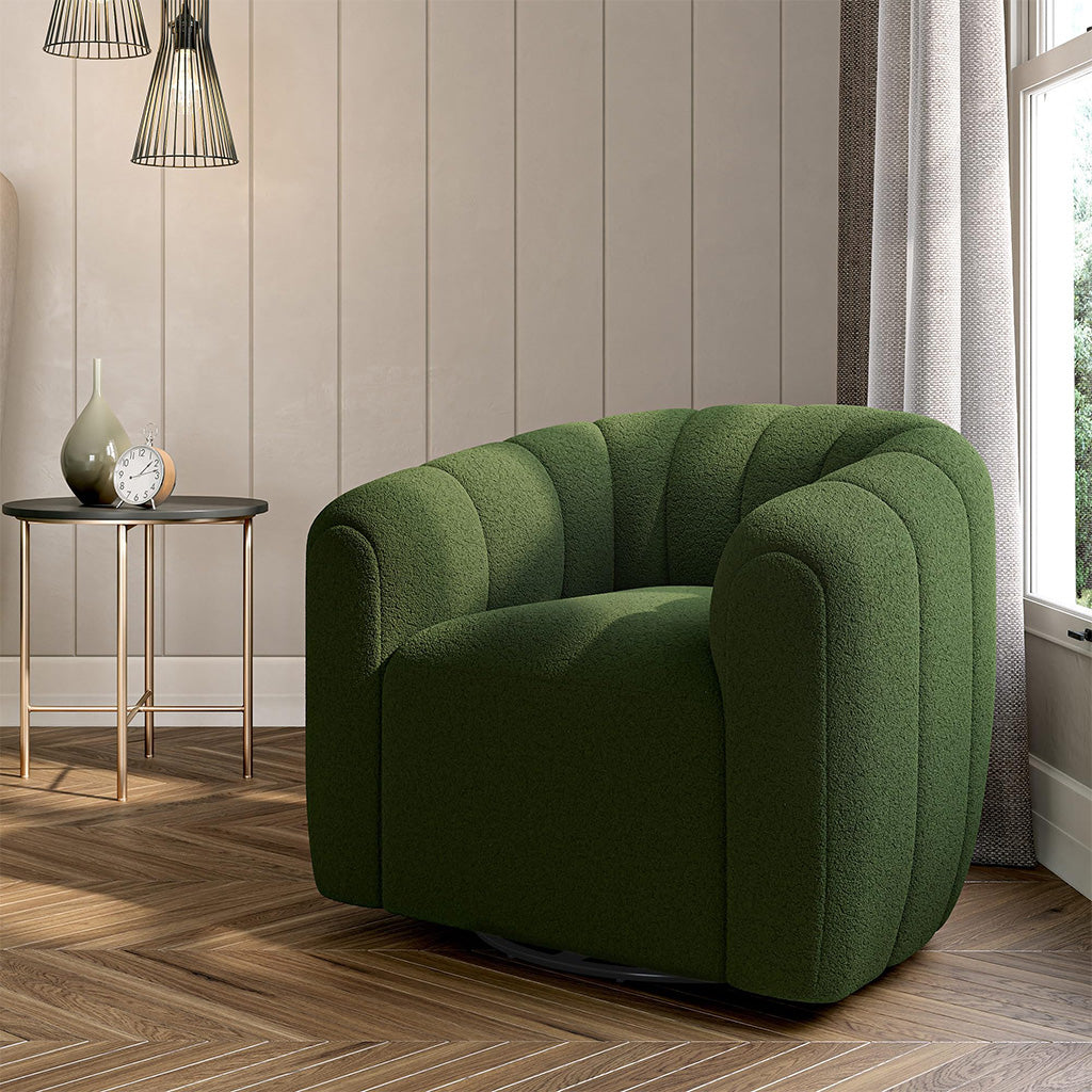 A dark green swivel barrel chair