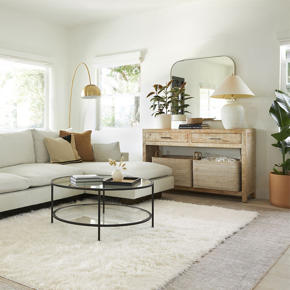 Layered cream pile rug and gray rugs